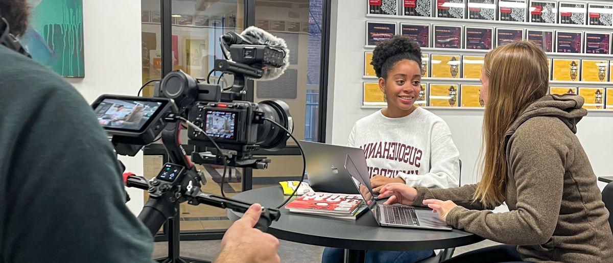 Image of videographer filming students for Amazon Prime's The College Tour.